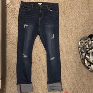 Fitted boyfriend ripped jeans, rolled ankle detail